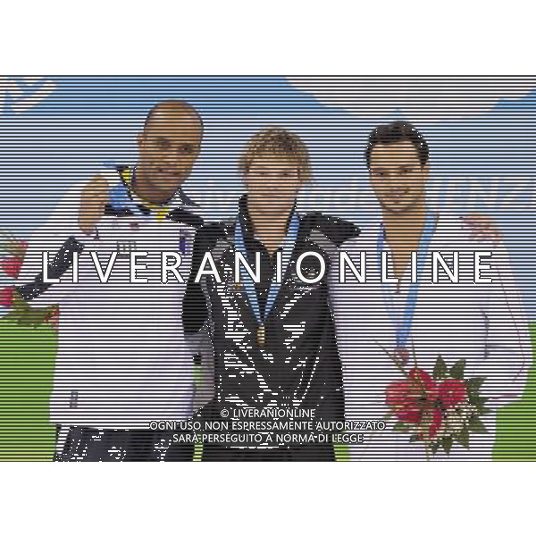 (110818) -- SHENZHEN, Aug. 18, 2011 () -- Gold medalist Glenn Snyders of New Zealand (C), silver medalist Joao Gomes Junior of Brazil (L), and bronze medalist Mattia Pesce of Italy pose for group photos during the awarding cermony of men\'s 50m breaststroke of swimming at the 26th Summer Universiade in Shenzhen, a city of south China\'s Guangdong Province, Aug. 18, 2011. G (/Liang Xu)