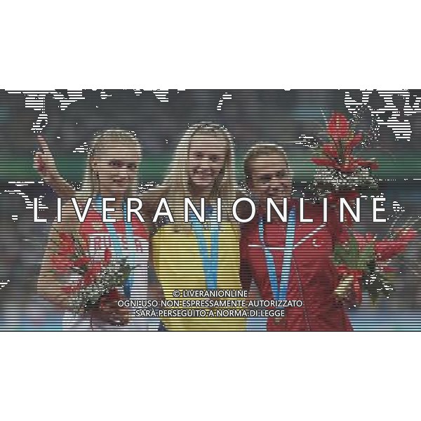 (110818) -- SHENZHEN, Aug. 18, 2011 () -- Gold medalist Anna Yaroshchuk of Ukraine (C), silver medalist Irina Davydova of Russia (L) and bronze medalist Nagihan Karadere of Turkey celebrate during the awarding ceremony for the women\'s 400m hurdles race of athletics event at the 26th Summer Universiade, in Shenzhen, a city of south China\'s Guangdong Province, Aug. 18, 2011. (/Liao Yujie) (bxf)