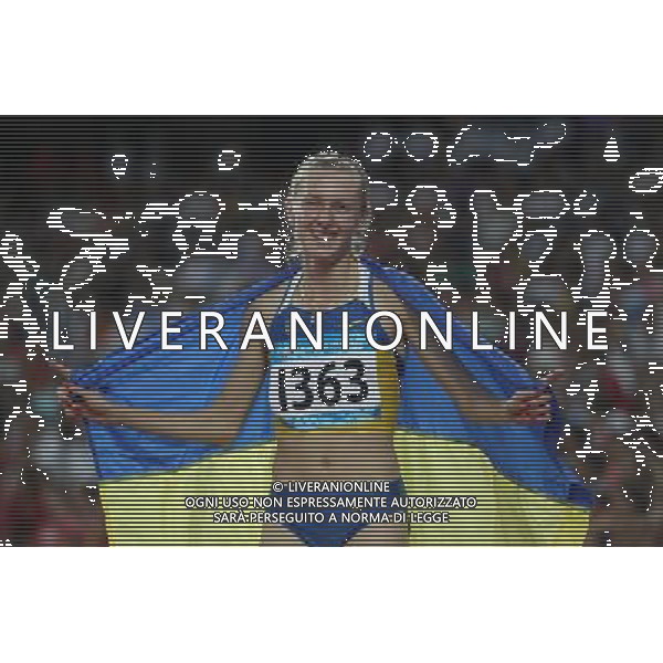(110818) -- SHENZHEN, Aug. 18, 2011 () -- Olha Zavhorodnya of Ukraine celebrates after winning the women\'s 800M final race of athletics event at the 26th Summer Universiade, in Shenzhen, a city of south China\'s Guangdong Province, Aug. 18, 2011. Olha Zavhorodnya won the gold medal with 1 minutes 59.56 seconds. (/Liao Yujie) (bxf)