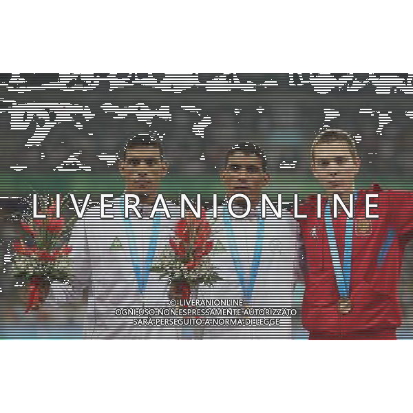 (110818) -- SHENZHEN, Aug. 18, 2011 () -- Gold medalist Imad Touil of Algeria (C), his teammate silver medalist Abdelmadjed Touil (L) and bronze medalist Valentin Smirnov of Russia celebrate during the awarding ceremony for the men\'s 1500m race of athletics event at the 26th Summer Universiade, in Shenzhen, a city of south China\'s Guangdong Province, Aug. 18, 2011. Imad Touil won the gold medal with 3 minutes 48.13 seconds. (/Liao Yujie) (bxf)