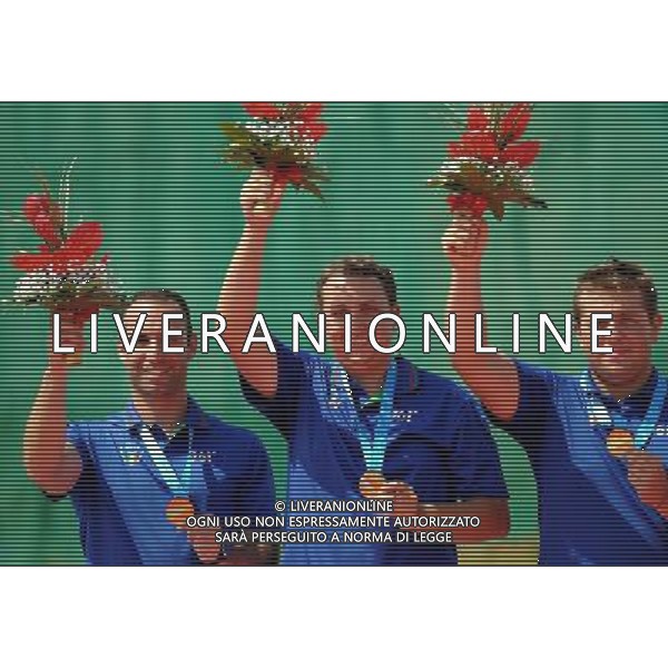 (110819) -- SHENZHEN, Aug. 19, 2011 () -- Shooters of Italy celebrate during the awarding ceremony of men\'s trap team event of shotgun at the 26th Summer Universiade in Shenzhen, a city of south China\'s Guangdong Province, on Aug. 19, 2011. Team of Italy won the gold medal of the event. (/Lin Yiguang)(wx)