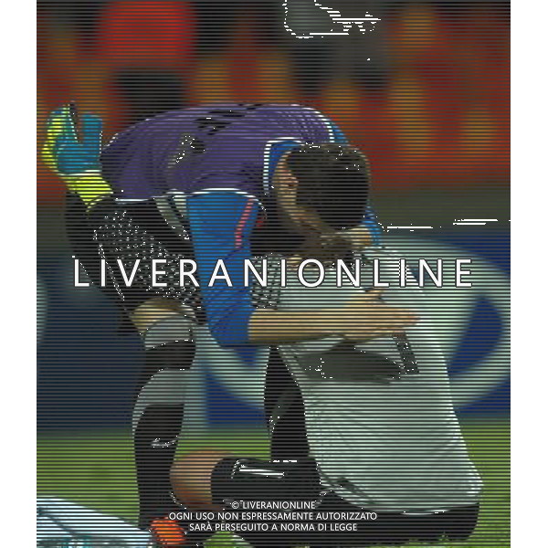 (110818) -- MEDELLIN, Aug. 18, 2011 () -- France\'s goalkeeper Mika (R) hugs a teammate after losing to Portugal after the semifinal of the FIFA World Cup U20 at the Atanasio Gorardot stadium, in Medellin, Colombia, on Aug. 17, 2011. France lost 0-2. (/Str) (ce)