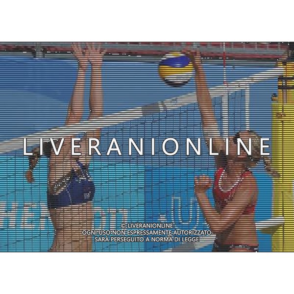 (110819) -- SHENZHEN, Aug. 19, 2011 () -- Karla Borger (R) of Germany competes during the women\'s beach volleyball gold medal match against Heather Hughes and Emily Day of the United States at the 26th Summer Universiade in Shenzhen, a city of south China\'s Guangdong Province, Aug. 19, 2011. Karla Borger and Britta Kristin Buethe won 2-0 to claim the gold. (/Gong Lei)(lm)