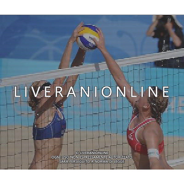 (110819) -- SHENZHEN, Aug. 19, 2011 () -- Britta Kristin Buethe (R) of Germany competes during the women\'s beach volleyball gold medal match against Heather Hughes and Emily Day of the United States at the 26th Summer Universiade in Shenzhen, a city of south China\'s Guangdong Province, Aug. 19, 2011. Karla Borger and Britta Kristin Buethe won 2-0 to claim the gold. (/Guo Yong)(lm)