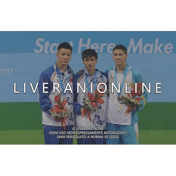 (110819) -- SHENZHEN, Aug. 19, 2011 () -- Gold medalist Lin Jin of China (C), silver medalist Sun Zhiyi of China (L), and bronze medalist Illya Kvasha of Ukraine pose on the podium during the awarding ceremony of men\'s 1m springboard of diving event at the 26th Summer Universiade in Shenzhen, a city of south China\'s Guangdong Province, on Aug. 19, 2011. (/Lu Hanxin)