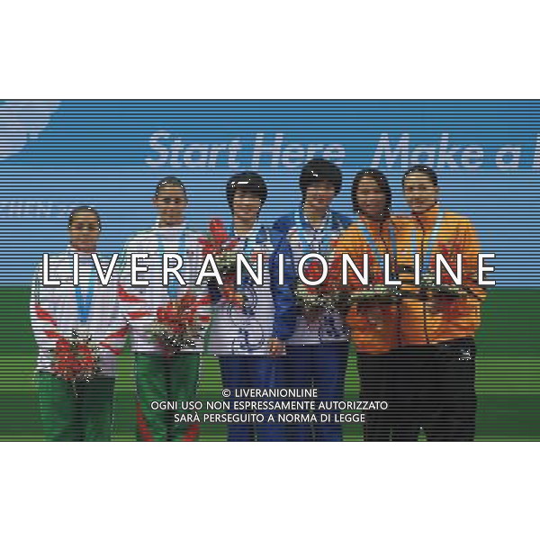 (110819) -- SHENZHEN, Aug. 19, 2011 () -- Wang Xin/Chen Ruolin of China (C), Paola Espinosa/Tatiana Ortiz of Mexico (L) and Pandalela Rinong Anak Pamg/Leong Mun Yee of Malaysia pose during the awarding ceremony of the women\'s synchronized 10m platform final of diving event at the 26th Summer Universiade in Shenzhen, a city of south China\'s Guangdong Province, Aug. 19, 2011. Wang and Chen won the gold with 349.98 points. Paola Espinosa/Tatiana Ortiz and Pandalela Rinong Anak Pamg/Leong Mun Yee won the silver and the bronze with 330.48 and 316.98 points respectively. (/Lu Hanxin)(lm)