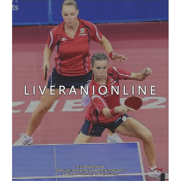 (110819) -- SHENZHEN, Aug. 19, 2011 () -- Dana Hadacova (above) and Iveta Vacenovska of Czech Republic compete during the women\'s doubles table tennis semifinal against Tang Liying and Xiong Xinyun of China at the 26th Summer Universiade in Shenzhen, a city of south China\'s Guangdong Province, Aug. 19, 2011. Dana Hadacova and Iveta Vacenovska lost 2-4 to miss the final. (/Yang Shiyao)(lm)