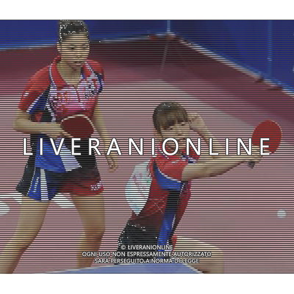 (110819) -- SHENZHEN, Aug. 19, 2011 () -- Jee Min Hyung (R) and Moon Mi Ra of South Korea compete during the women\'s doubles table tennis semifinal against Ma Yuefei and Rao Jingwen of China at the 26th Summer Universiade in Shenzhen, a city of south China\'s Guangdong Province, Aug. 19, 2011. Jee Min Hyung and Moon Mi Ra lost 0-4 to miss the final. (/Yang Shiyao)(lm)