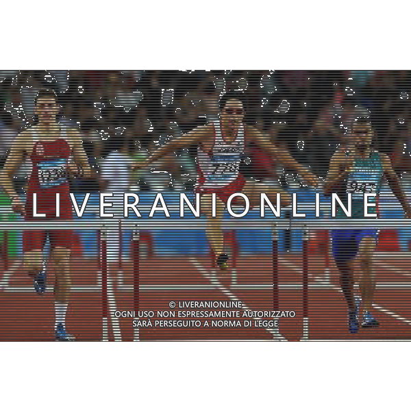 (110819) -- SHENZHEN, Aug. 19, 2011 () -- Takayuki Kishimoto (C) of Japan competes during the men\'s 400m hurdles final of athletics event at the 26th Summer Universiade in Shenzhen, a city of south China\'s Guangdong Province, on Aug. 19, 2011. Takayuki Kishimoto claimed the silver medal with a time of 49.52 seconds. (/Lin Yiguang)