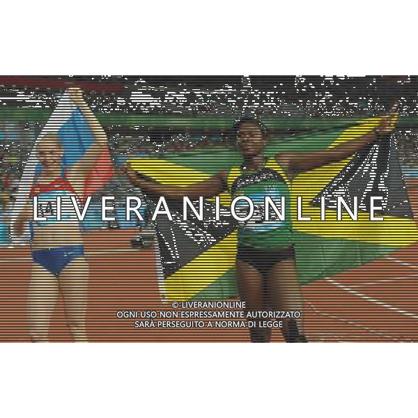 (110819) -- SHENZHEN, Aug. 19, 2011 () -- Anneisha Mclaughlin (R) of Jamaica celebrates after finishing the women\'s 200m final of athletics event at the 26th Summer Universiade in Shenzhen, a city of south China\'s Guangdong Province, on Aug. 19, 2011. Anneisha Mclaughlin claimed the gold medal with a time of 22.54 seconds. (/Lin