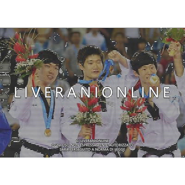 (110819) -- SHENZHEN, Aug. 19, 2011 () -- An Jae Seong, Lee Sang Mok and Jang Jun Hee (from L to R) of South Korea pose during the awarding ceremony of the men\'s team poomsae final at the 26th Summer Universiade in Shenzhen, a city of south China\'s Guangdong Province, Aug. 19, 2011. South Korea won the gold. (/Liang Xu)(lm)