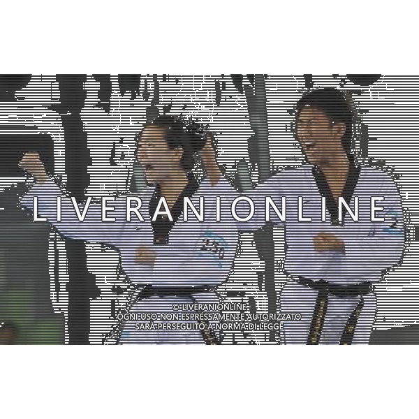 (110819) -- SHENZHEN, Aug. 19, 2011 () -- Lee Jin Ho (R) and Kang Su Ji of South Korea perform during the mixed team poomsae final at the 26th Summer Universiade in Shenzhen, a city of south China\'s Guangdong Province, Aug. 19, 2011. Lee Jin Ho and Kang Su Ji won the gold. (/Liang Xu)(lm)