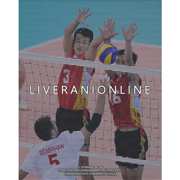 (110820) -- SHENZHEN, Aug. 20, 2011 () -- Chinese Jiang Meng (L) and Chen Jiehong (R) block the ball during men\'s volleyball 17-20 semifinal match at the 26th Summer Universiade in Shenzhen, a city of south China\'s Guangdong Province, on Aug. 20, 2011. China lost Turkey 0-3. (/Li Ga)(wx)