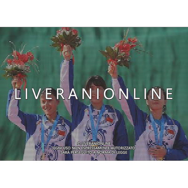 (110820) -- SHENZHEN, Aug. 20, 2011 () -- Lu Min, Yu Xiumin and Yang Jing of China celebrate during the awarding ceremony of the women\'s skeet team of shotgun at the 26th Summer Universiade in Shenzhen, a city of south China\'s Guangdong Province, Aug. 20, 2011. The team of China claimed the gold medal of the event with a total of 204 hits. (/Lin Yiguang)