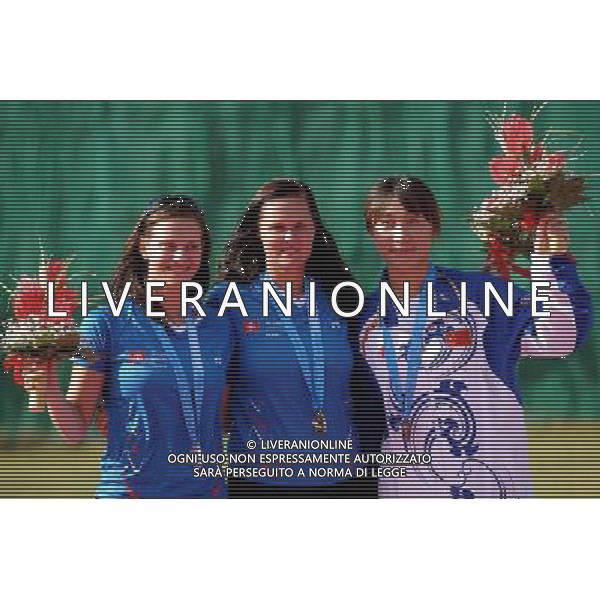 (110820) -- SHENZHEN, Aug. 20, 2011 () -- Gold medalist Monica Zemkova of Slovakia (C), silver medalist Danka Bartekova of Slovakia (L), and bronze medalist Yu Xiumin of China celebrate during the awarding ceremony of the women\'s skeet of shotgun at the 26th Summer Universiade in Shenzhen, a city of south China\'s Guangdong Province, Aug. 20, 2011. (/Lin Yiguang)