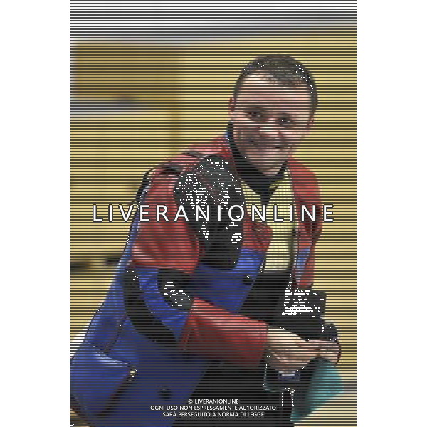 (110820) -- SHENZHEN, Aug. 20, 2011 () -- Yury Shcherbatsevish of Belarus smiles after finishing the 50m rifle prone men individual of shooting event at the 26th Summer Universiade in Shenzhen, a city of south China\'s Guangdong Province, on Aug. 20, 2011. Yury Shcherbatsevish claimed the gold medal of the event. (/Chen Yehua)