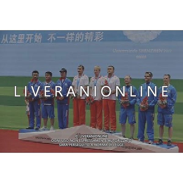 (110820) -- SHENZHEN, Aug. 20, 2011 () -- Gold medalists shooters of Belarus (C), silver medalists shooters of Mongolia (L), and bronze medalists shooters of Sweden pose on the podium during the 50m rifle prone men team of shooting event at the 26th Summer Universiade in Shenzhen, a city of south China\'s Guangdong Province, on Aug. 20, 2011. (/Chen Yehua)