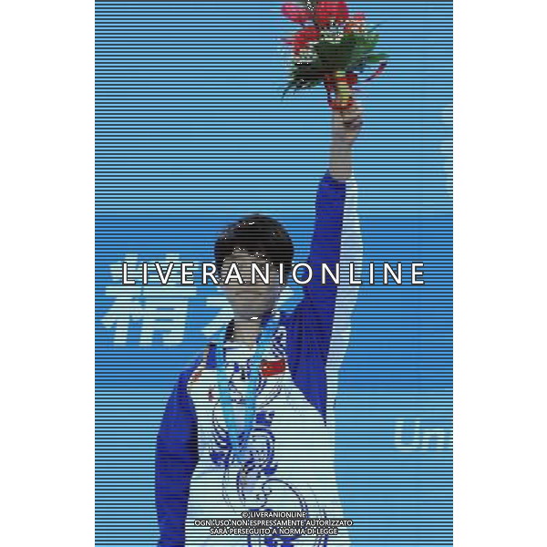 (110820) -- SHENZHEN, Aug. 20, 2011 () -- China\'s Rao Jingwen poses for photos during the awarding ceremony for the women\'s singles of table tennis event at the 26th Summer Universiade in Shenzhen, a city of south China\'s Guangdong Province, Aug. 20, 2011. Rao claimed the title of the event. (/Yang Shiyao)(bxf)