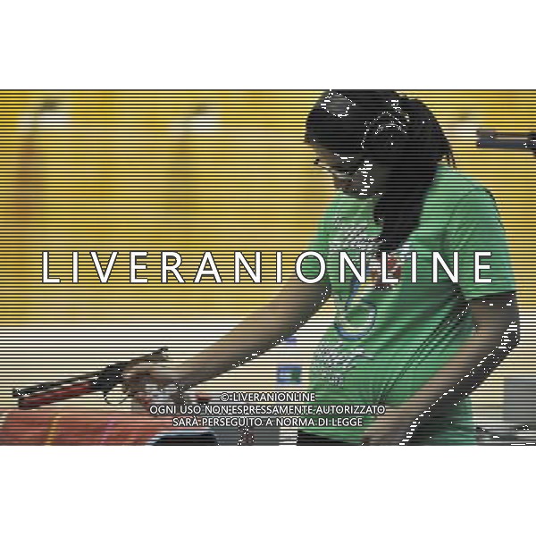 (110820) -- SHENZHEN, Aug. 20, 2011 () -- Juhi Talwar of India ponders during the 10m air pistol women individual qualification of shooting event at the 26th Summer Universiade in Shenzhen, a city of south China\'s Guangdong Province, on Aug. 20, 2011. The team of India claimed the gold medal of women\'s 10m air pistol team event. (/Chen Yehua)