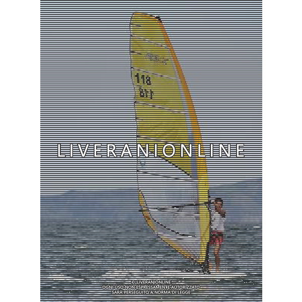 (110820) -- SHENZHEN, Aug. 20, 2011 () -- Fang Zhennan of China competes during the men\'s RS:X (windsurf) race of sailing event at the 26th Summer Universiade in Shenzhen, a city of south China\'s Guangdong Province, Aug. 20, 2011. Fang ranked the 1st with a net points of 17 after 10 races. (/Wang Haofei)(bxf)