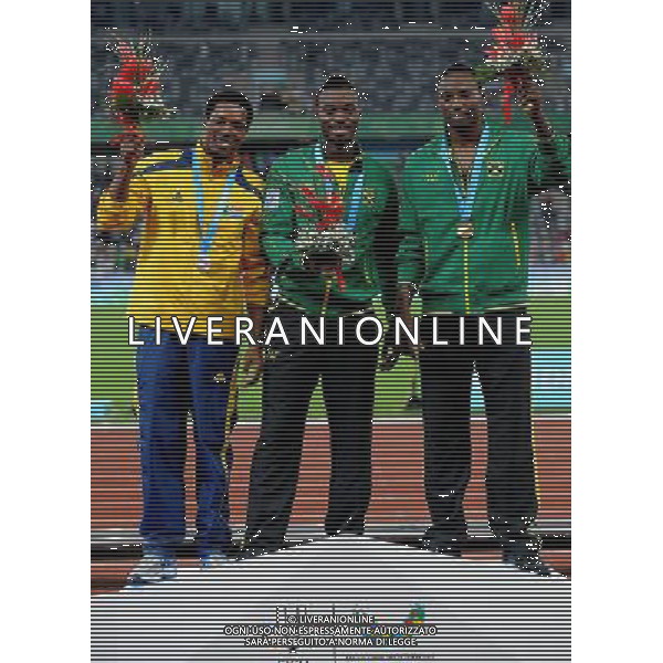 (110819) -- SHENZHEN, Aug. 19, 2011 () -- Gold medalist Rasheed Dwyer of Jamaica (C), silver medalist Thuso Mpuang of Russia (L) and bronze medalist Jason Young of Jamaica pose during the awarding ceremony of the men\'s 200m of athletics event at the 26th Summer Universiade in Shenzhen, a city of south China\'s Guangdong Province, on Aug. 19, 2011. (/Lin Yiguang)