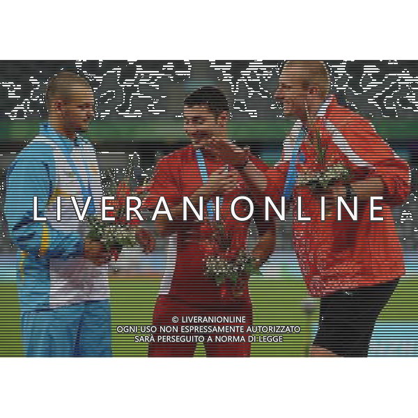 (110819) -- SHENZHEN, Aug. 19, 2011 () -- Gold medalist Fatih Avan (C) of Turkey, silver medalist Roman Avramenko (L) of Ukraine and bronze medalist Igor Janik of Poland celebrate during the awarding ceremony of men\'s javelin of athletics event at the 26th Summer Universiade in Shenzhen, a city of south China\'s Guangdong Province, on Aug. 19, 2011. (/Lin Yiguang) (bxf)