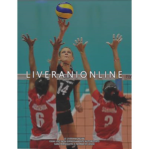 (110820) -- HONG KONG, Aug. 20, 2011 () -- Margareta Kozuch (C) of Germany spikes the ball during the Group J match of the women\'s World Grand Prix Hong Kong session between Germany and Peru in Hong Kong, south China, Aug. 20, 2011. Germany won 3-1. (/Lo Ping Fai)