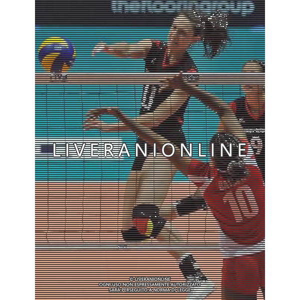 (110820) -- HONG KONG, Aug. 20, 2011 () -- Christiane Furst (L) of Germany spikes the ball during the Group J match of the women\'s World Grand Prix Hong Kong session between Germany and Peru in Hong Kong, south China, Aug. 20, 2011. Germany won 3-1. (/Lo Ping Fai)