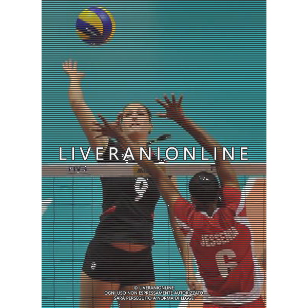 (110820) -- HONG KONG, Aug. 20, 2011 () -- Corina Ssuschke-Voigt (L) of Germany spikes the ball during the Group J match of the women\'s World Grand Prix Hong Kong session between Germany and Peru in Hong Kong, south China, Aug. 20, 2011. Germany won 3-1. (/Lo Ping Fai)