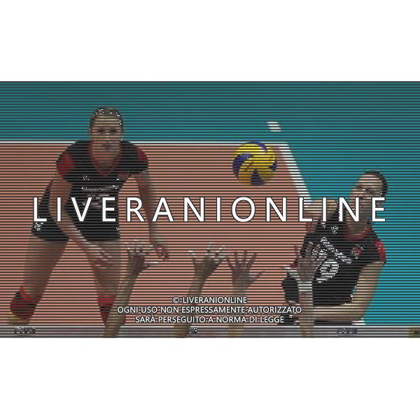 (110820) -- HONG KONG, Aug. 20, 2011 () -- Regina Burchardt (R) of Germany spikes the ball during the Group J match of the women\'s World Grand Prix Hong Kong session between Germany and Peru in Hong Kong, south China, Aug. 20, 2011. Germany won 3-1. (/Li Qiuchan)