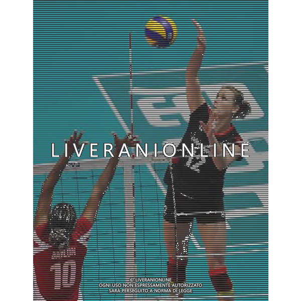 (110820) -- HONG KONG, Aug. 20, 2011 () -- Heike Beier (R) of Germany spikes the ball during the Group J match of the women\'s World Grand Prix Hong Kong session between Germany and Peru in Hong Kong, south China, Aug. 20, 2011. Germany won 3-1. (/Li Qiuchan)