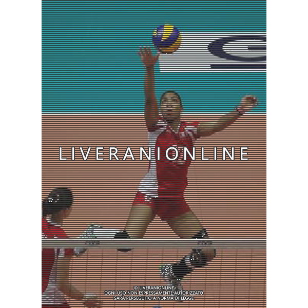 (110820) -- HONG KONG, Aug. 20, 2011 () -- Carla Rueda of Peru spikes the ball during the Group J match of the women\'s World Grand Prix Hong Kong session between Germany and Peru in Hong Kong, south China, Aug. 20, 2011. Germany won 3-1. (/Li Qiuchan)