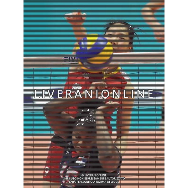 (110819) -- HONG KONG, Aug. 19, 2011 () -- Yang Junjing (Back) of China spikes the ball during the Group I match of the women\'s World Grand Prix Hong Kong session between China and Dominica at Hong Kong Coliseum in Hong Kong, south China, Aug. 19, 2011. China won 3-0. (/Lo Ping Fai)