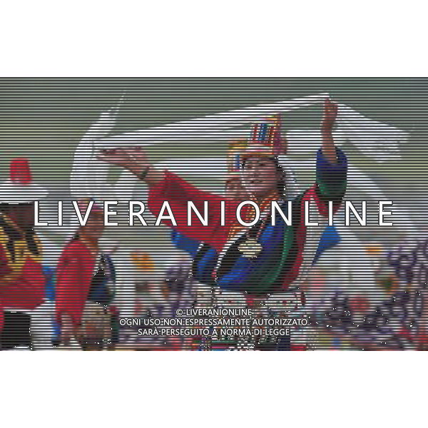 (110819) -- DAMXUNG, Aug. 19, 2011 () -- People in traditional costumes dance during the opening ceremony of a horse race festival held in Damxung, southwest China\'s Tibet Autonomous Region, Aug. 19, 2011. The seven-day horse race festival, with the history of more than 300 years, is held in Damxung in August each year. (/Tao Xiyi)(mcg)