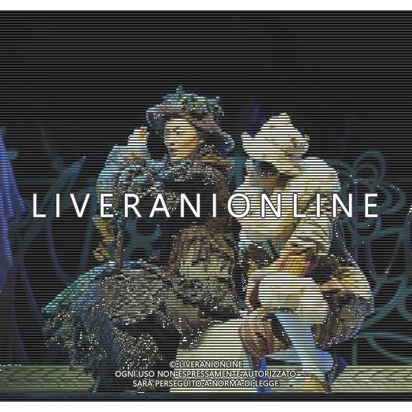 (110820) -- HARBIN, Aug. 20, 2011 () -- \'Gingerbread man\' (R) and the \'Old bag\' perform during the debut of musical play \'the Gingerbread Man\' in Harbin Drama Theater in Harbin, capital of northeast China\'s Heilongjiang Province, Aug. 20, 2011. \'The Gingerbread Man\', a well-known musical play for children created by English playwright David Wood, was staged here on Saturday. (/Wang Song) (xzj)