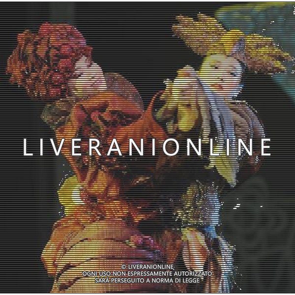 (110820) -- HARBIN, Aug. 20, 2011 () -- \'Miss Peper\' (L) and \'Herr Von Cuckoo\' perform during the debut of musical play \'the Gingerbread Man\' in Harbin Drama Theater in Harbin, capital of northeast China\'s Heilongjiang Province, Aug. 20, 2011. \'The Gingerbread Man\', a well-known musical play for children created by English playwright David Wood, was staged here on Saturday. (/Wang Song) (xzj)