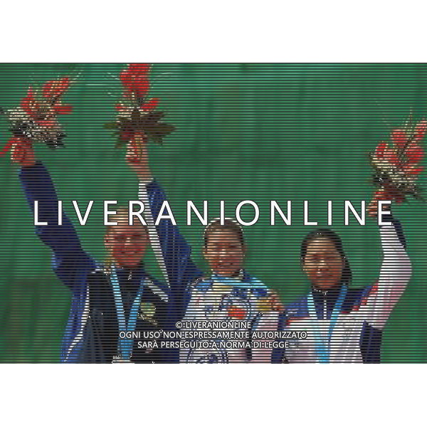 (110822) -- SHENZHEN, Aug. 22, 2011 () -- Gold medalist Yang Xiaohui (C) of China, silver medalist Mariya Dmitriyenko (L) of Kazakhstan and bronze medalist Hsu Jieyu of Chinese Taipei react during women\'s double trap event of shotgun at the 26th Summer Universiade in Shenzhen, a city of south China\'s Guangdong Province, on Aug. 22, 2011. (/Lin Yiguang)(wx)