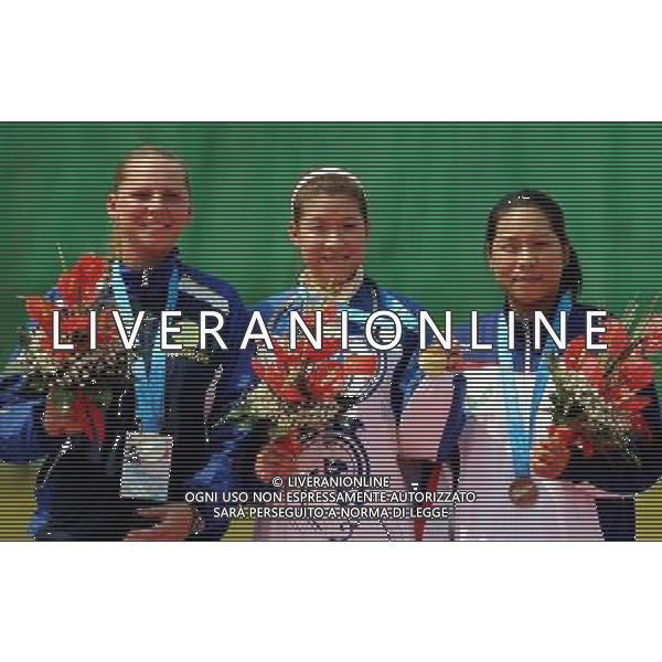 (110822) -- SHENZHEN, Aug. 22, 2011 () -- Gold medalist Yang Xiaohui (C) of China, silver medalist Mariya Dmitriyenko (L) of Kazakhstan and bronze medalist Hsu Jieyu of Chinese Taipei react during women\'s double trap event of shotgun at the 26th Summer Universiade in Shenzhen, a city of south China\'s Guangdong Province, on Aug. 22, 2011. (/Lin Yiguang)(wx)