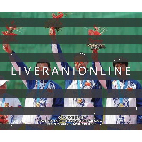 (110822) -- SHENZHEN, Aug. 22, 2011 () -- Gold medalists China\'s team react during the awarding ceremony of men\'s double trap team event of shotgun at the 26th Summer Universiade in Shenzhen, a city of south China\'s Guangdong Province, on Aug. 22, 2011. Chinese team won the gold with a total score of 427. (/Lin Yiguang)(wx)