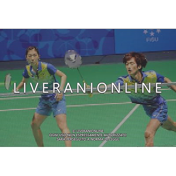 (110822) -- SHENZHEN, Aug. 22, 2011 () -- Shin Baek Cheol (R) of South Korea returns the shuttle during mixed doubles match of badminton at the 26th Summer Universiade in Shenzhen, a city of south China\'s Guangdong Province, on Aug. 22, 2011. Shin Baek Cheol/Eom Hye Won of South Korea won Lee Shengmu/Hsieh Peichen of Chinese Taipei 2-1 to win the gold medal. (/Wang Song)(wx)