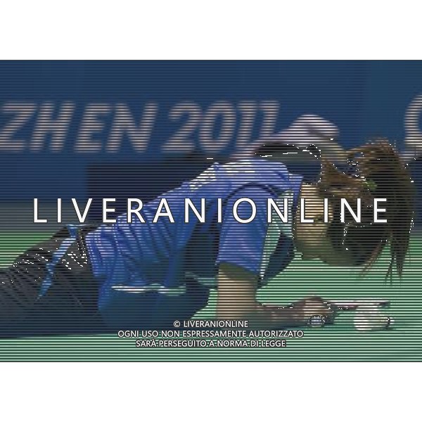 (110822) -- SHENZHEN, Aug. 22, 2011 () -- Hsieh Peichen of Chinese Taipei reacts during mixed doubles match of badminton at the 26th Summer Universiade in Shenzhen, a city of south China\'s Guangdong Province, on Aug. 22, 2011. Shin Baek Cheol/Eom Hye Won of South Korea won Lee Shengmu/Hsieh Peichen of Chinese Taipei 2-1 to win the gold medal. (/Lui Sui Wai)(wx)
