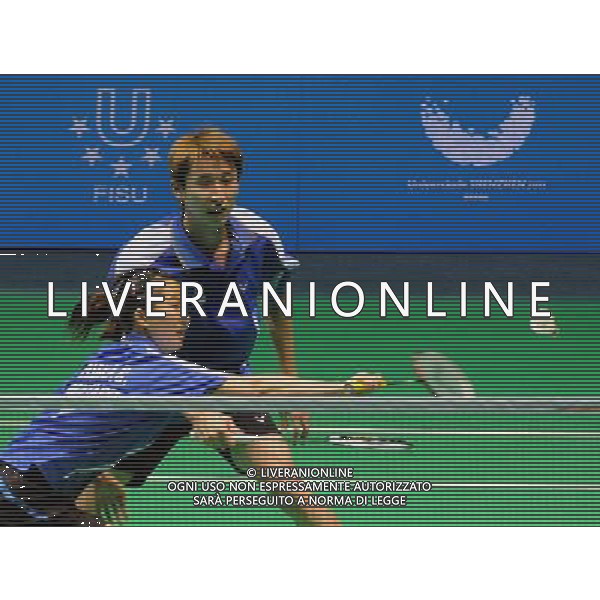 (110822) -- SHENZHEN, Aug. 22, 2011 () -- Hsieh Peichen (Front) of Chinese Taipei returns the shuttle during mixed doubles match of badminton at the 26th Summer Universiade in Shenzhen, a city of south China\'s Guangdong Province, on Aug. 22, 2011. Lee Shengmu/Hsieh Peichen of Chinese Taipei lost Shin Baek Cheol/Eom Hye Won of South Korea 1-2 to win the silver medal. (/Wang Song)(wx)