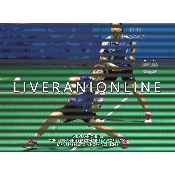 (110822) -- SHENZHEN, Aug. 22, 2011 () -- Lee Shengmu (Front) of Chinese Taipei returns the shuttle during mixed doubles match of badminton at the 26th Summer Universiade in Shenzhen, a city of south China\'s Guangdong Province, on Aug. 22, 2011. Lee Shengmu/Hsieh Peichen of Chinese Taipei lost Shin Baek Cheol/Eom Hye Won of South Korea 1-2 to win the silver medal. (/Wang Song)(wx)