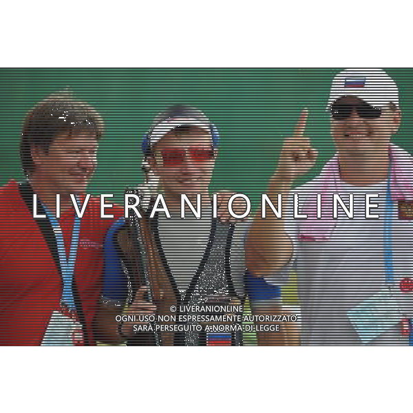 (110822) -- SHENZHEN, Aug. 22, 2011 () -- Alexander Furasyev (C) of Russia celebrates after men\'s double trap event of shotgun at the 26th Summer Universiade in Shenzhen, a city of south China\'s Guangdong Province, on Aug. 22, 2011. Alexander Furasyev won the gold medal with a total score of 193. (/Lin Yiguang)(wx)