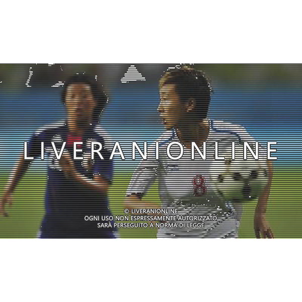 (110821) -- SHENZHEN, Aug. 21, 2011 () -- Wang Chen (R) of China chases the ball during the women\'s soccer final against Japan at the 26th Summer Universiade in Shenzhen, a city of south China\'s Guangdong Province, on Aug. 21, 2011. China claimed the title by defeating Japan with 2-1. (/Wang Haofei)(wll)