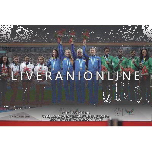 (110821) -- SHENZHEN, Aug. 21, 2011 () -- Athletes of Ukraine (C), the United States (L), and Jamaica celebrate during the awarding cermony of the women\'s 4x100m relay of athletics at the 26th Summer Universiade in Shenzhen, a city of south China\'s Guangdong Province, on Aug. 21, 2011. Ukraine, the United States, and Jamaica won the gold, silver and bronze medals of the event respectively. (/Li Ming)