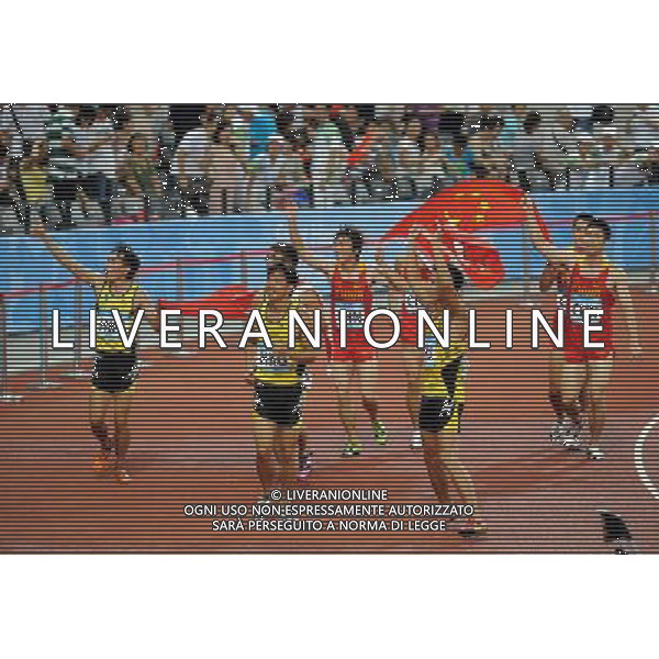 (110821) -- SHENZHEN, Aug. 21, 2011 () -- Sprinters of China and Chinese Hong Kong celebrate after men\'s 4X100m relay race of athletics at the 26th Summer Universiade in Shenzhen, a city of south China\'s Guangdong Province, on Aug. 21, 2011. China and Chinese Hong Kong took the silver and bronze respectively. (/Guo Yong)(wll)