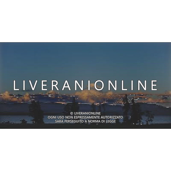 (110821) -- NEW YORK, Aug. 21, 2011 () -- Photo taken on Aug. 10, 2011 shows the scenery of Yellowstone Lake at dusk in Yellowstone National Park, the United States. Established in 1872, Yellowstone is a national park located primarily in the state of Wyoming, although it also extends into Montana and Idaho. Yellowstone was the first national park in the world and is known for its wildlife and its many geothermal features. (/Shen Hong) (wjd)