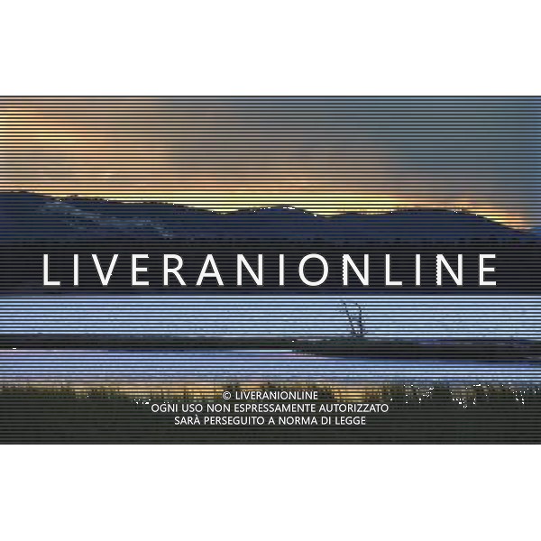 (110821) -- NEW YORK, Aug. 21, 2011 () -- Photo taken on Aug. 11, 2011 shows the scenery of Yellowstone Lake at dawn in Yellowstone National Park, the United States. Established in 1872, Yellowstone is a national park located primarily in the state of Wyoming, although it also extends into Montana and Idaho. Yellowstone was the first national park in the world and is known for its wildlife and its many geothermal features. (/Shen Hong) (wjd)