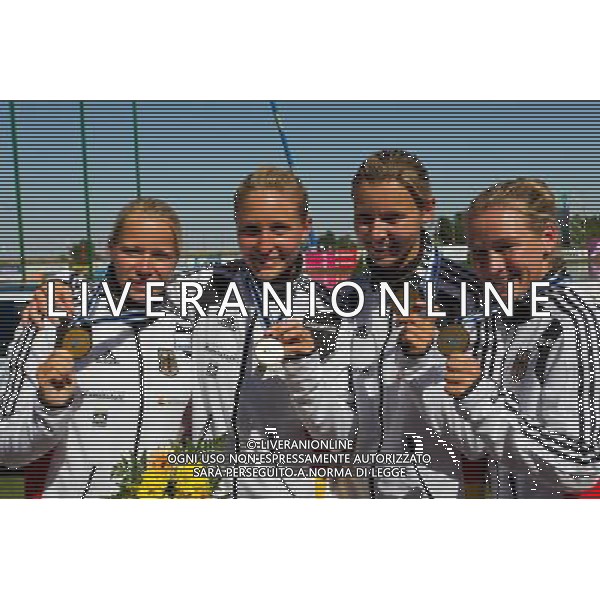 (110822) -- SZEGED, Aug. 22, 2011 () -- Nicole Reinhardt, Conny Wassmuth, Tina Dietze and Carolin Leonhardt from Germany pose in the awarding ceremony for the women\'s K1 4x200m relay event of the 2011 ICF World Canoe Sprint Championships in Szeged, Hungary, Aug. 21, 2011. They claimed the title in 2 minutes and 49.541 seconds. (/Attila Volgyi)
